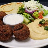 Falafel Platter · Ground chickpea patties seasoned with herbs and spices then deep-fried. Served with a salad,...