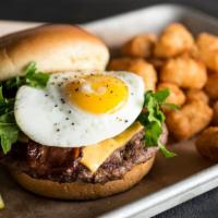 Brunch Burger* · Beer - Infused.  Fresh Angus beef burger topped with cheddar cheese, crisp applewood smoked ...