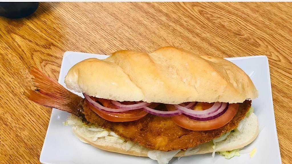 Minuta Sandwich · Fresh snapper breaded deep fried with the tail on.