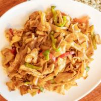 Drunken Noodles · Flat noodles sautéed with white onions, bell peppers, green bean, basil leaves in Thai hot s...