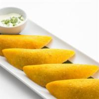 Colombian Empanadas · Authentic Colombian patties filled with beef and potatoes, served with cilantro sauce.