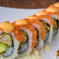 *Orange Dragon Roll · Shrimp tempura, asparagus, avocado, spicy mayo, Eel sauce, tempura flakes with salmon on top.