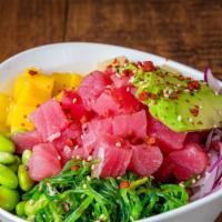 *Hawaii Style · Tuna poke marinated with sesame seeds and spicy mayo sauce, red onions, bacon bits, mango, p...