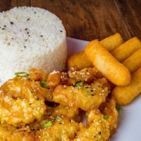 Honey Garlic Chicken · Strips of fried chicken breast sautéed in our honey garlic sauce and served with two side or...