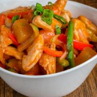 Sweet N' Sour Sauce · Sautéed tomatoes, cucumbers, bell peppers, pineapple and onions in a sweet and sour sauce.
