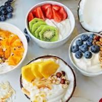 Yum Yum Yogurt Bowl · Acai bowl topped with  greek yogurt, granola, sliced banana, strawberries, blueberries, and ...