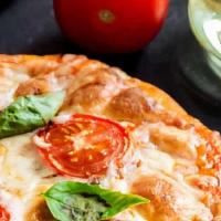 Margherita Pizza · Mozzarella cheese , fresh tomatoes , fresh garlic and basil (no sauce).