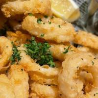 Fried Calamari · Calamari tender rings fried to perfection  and served with our homemade sauce.