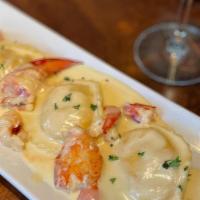App Lobster Ravioli · Three large, homemade raviolis stuffed with chunks of Maine lobster, topped with a goat chee...
