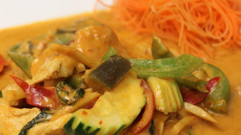 Yellow Chicken Curry · Spicy yellow curry of southern Thailand, sauteed with chicken, coconut milk, turmeric, cumin seed, potato, and carrot.
