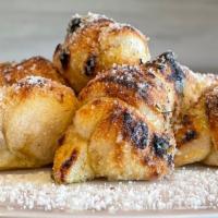 Garlic Knots · fresh dough baked into 8 knots and covered in garlic butter, parmesan cheese and oregano and...