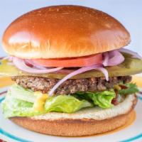 The Classic · A 1/4 pound gourmet burger served with lettuce tomato onions American cheese on a toasted br...