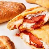 Calzone · Mozzarella and ricotta cheese with sauce on the side.