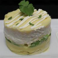 Causa De Pollo · Stuffed potato with avocado and pulled chicken breast with mayonnaise.