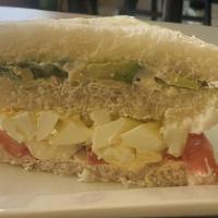 Triple Clasico Sandwich · Avocado, tomato, hard egg with mayonnaise in white bread.
