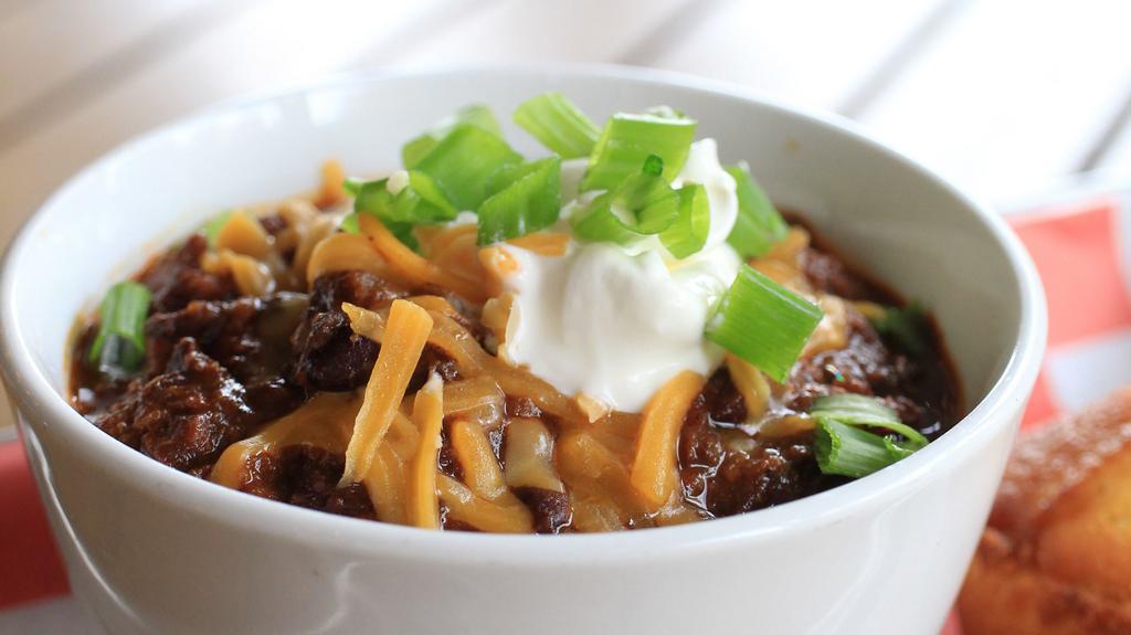 Chopped Brisket Chili · With sour cream, cheddar cheese, and chives.