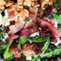 Spinach & Kale Salad · Spinach and kale mixed with grilled red onion, walnuts, goat cheese, dried cranberries. We r...