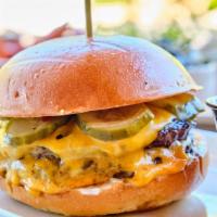 Wood Flame Burger · Double stacked wood flame burgers with American cheese, house-made pickles and garlic aioli ...