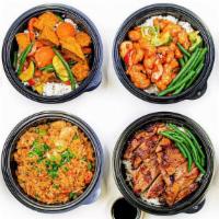 Family Meal Deal · 4 Chicken or Tofu Rice Bowls + 4 sides (choice of miso soup, house salad, or a pork egg roll)