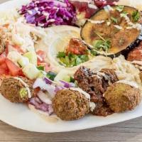 Falafel Plate  · Falafel on a plate with your choice of salads and a side. Served with a pita.