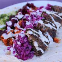 Beef Kebab Pita / Wrap · Beef kebab on your a pita or wrap with your choice of salads.