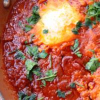 Shakshuka · Shakshuka served with a pita.