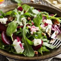 Beet Salad · Fresh salad with yummy arugula, roasted red and golden beets, red onions, herb goat cheese, ...