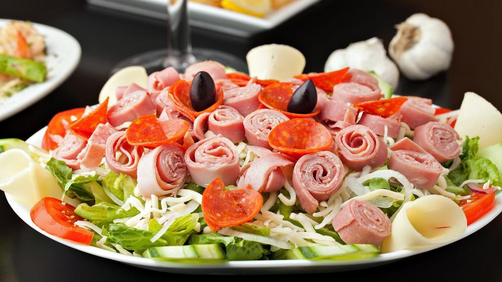 Antipasto Salad · Yummy garden salad with ham, provolone cheese, salami & capicola, and your choice of dressing.