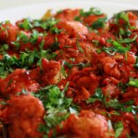 Chicken 65 · Spicy deep-fried chicken originating from South India. Chicken slices marinated with garlic ...