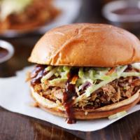 Taiga Sandwich · Delicious sandwich loaded with 1/4 pound, house-smoked juicy pulled pork, cured with juniper...