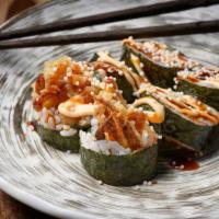 Spider Roll · Soft shell crab tempura, avocado, masago and cream cheese topped with eel sauce and spicy ma...