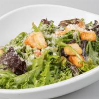 Caesar Salad · Homemade caesar dressing with bacon, lettuce mix and croutons.