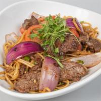 Wok-Tossed Noddles With Wok Smoked Lomo · Wok-seared Noodles with Tenderloin, Onions, Tomatoes and our special. sauce