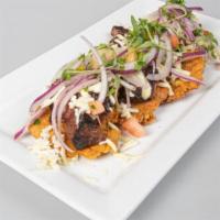 Simon Bolivar Tostones · Fried Green Plantains W/ Picanha, Chicken & Sausage covered with Shredded White Cheese and H...