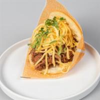 Arepa Pelua · Shredded beef with grated yellow cheese.