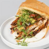 Arepa Llanera De Pollo · Grilled Chicken, chopped Avocado, Tomatoes, Onions and Soft White Cheese Arepa