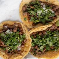 Street Tacos (1) · Topped with cilantro and onions. Side of tomatillo sauce.