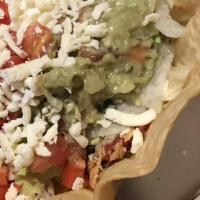 Taco Salad · Choice of ground beef or shredded chicken, filled with beans, lettuce, cheese, tomatoesl, an...