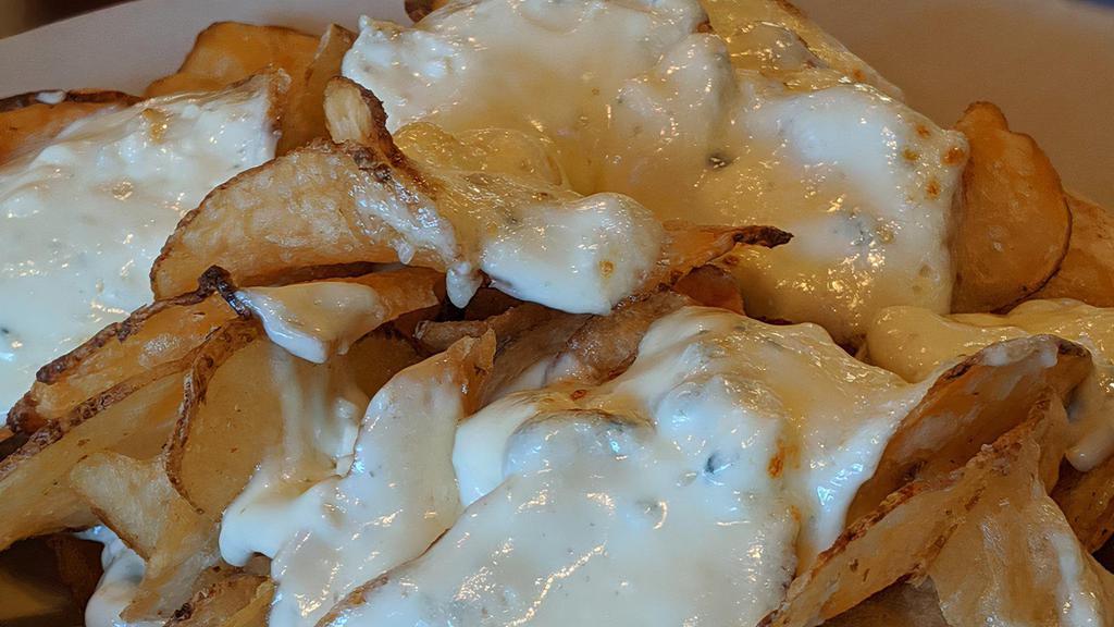 Tdc Bleu Chips · Homemade potato chips topped with our homemade signature bleu cheese.