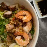 Clear Noodle Bowl - Hủ Tiếu Khô · Char siu BBQ pork, crunchy roast pork, shrimp, and boiled egg and side of soup.
