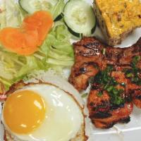 Combo · Pork chop, baked eggs and sunny-side egg.