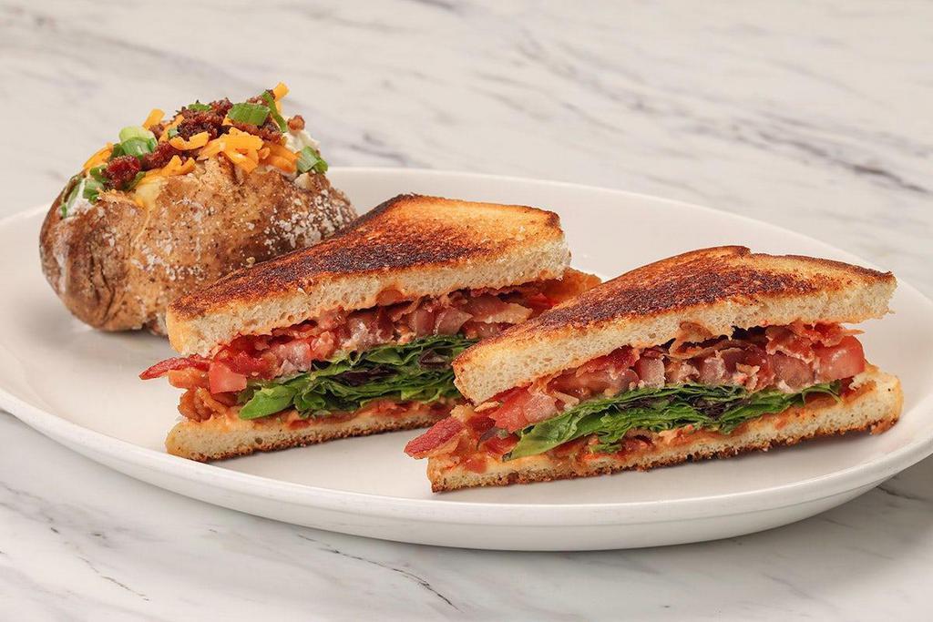 Blt Sandwich · Lettuce, tomato, apple-wood smoked bacon and tangy cilantro mayo on sourdough