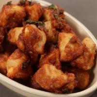 Chicken Pakora · Chicken tenderloins deep fried in a specially seasoned gram flour batter and served with chu...