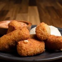 Tequeños · 6 Delicious sticks of white cheese wrapped with a homemade crunchy and slightly sweet dough ...