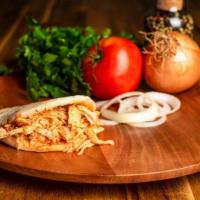 Arepa Con Pollo · Arepa stuffed with deliciously shredded chicken breast with Colombian Guizo!