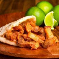 Arepa Con Chicharron · Arepa stuffed with our signature Fried crunchy  and savory Chicharrones !