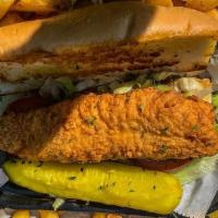 Fried Catfish · Fried Catfish on fresh baked French Bread dressed with Lettuce, Tomato and Pickle Spear. Com...