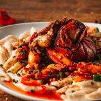 Jerk Lobster Rasta Pasta · Jerk Lobster tail ＆ meat, Penne Pasta, Peppers ＆ Onions, Jerk Alfredo Sauce.