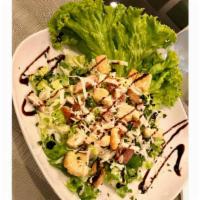 Not So Plain Jain Kitchen Salad · Iceberg lettuce with tomatoes, cucumbers, red onions, cheese, croutons. Your choice of ranch...