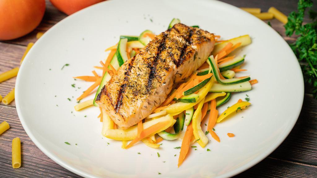 Filetto Di Salmone · Grilled salmon fillet. Served with a side of vegetables.